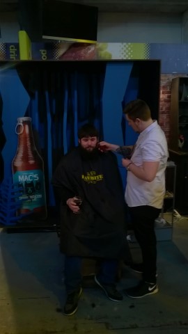 Getting a hair-cut at the Mac's stand